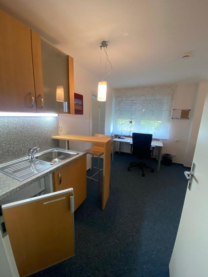 Awm Korntal Aparthotel Bagian luar foto