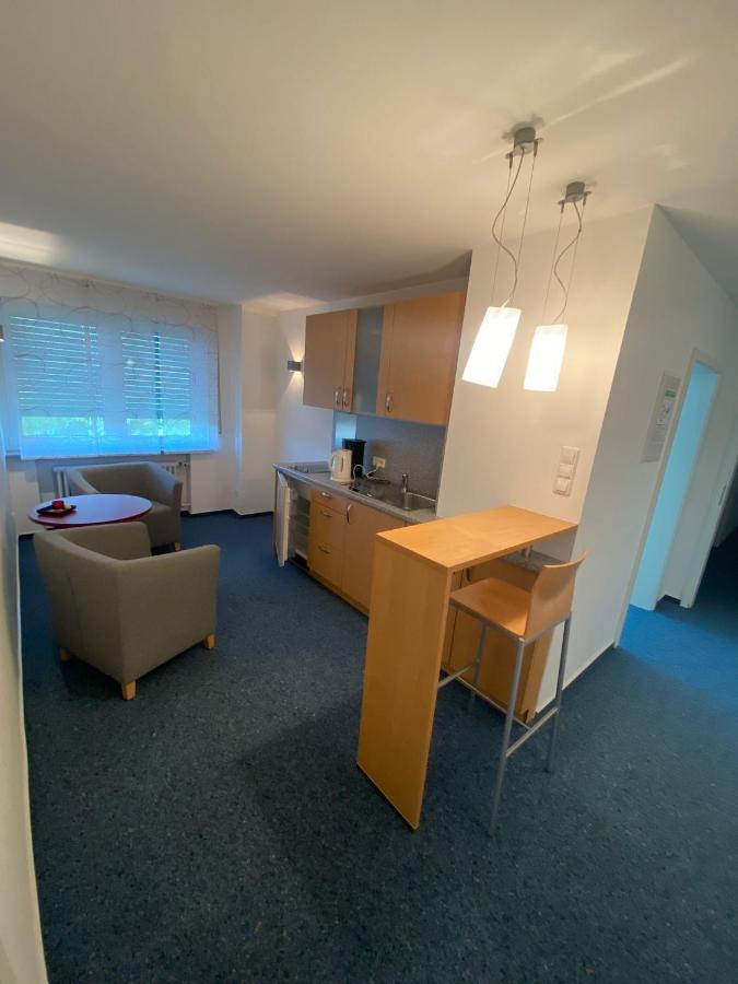 Awm Korntal Aparthotel Bagian luar foto